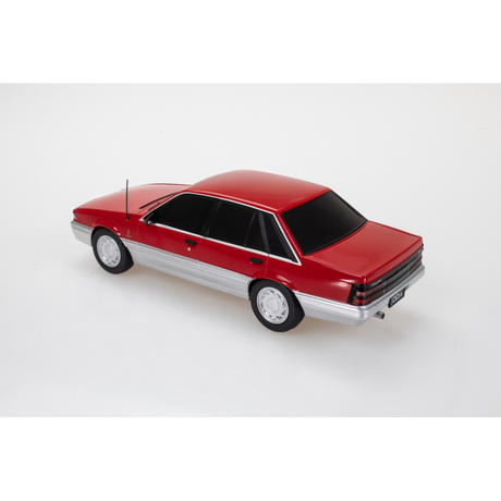 Holden VL Calais Spectra Rides Red Plastic Light Up Diecast Model Car 1:24 Scale (Approx. 18–20cm) Collectible | Universal Auto Spares
