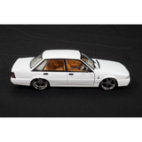 Side view of Holden VL Calais Custom 1:24 diecast with lowered stance and chrome five-spoke wheels