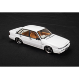 DDA Collectibles Holden VL Calais Custom 1:24 diecast in Metallic White, front three-quarter view
